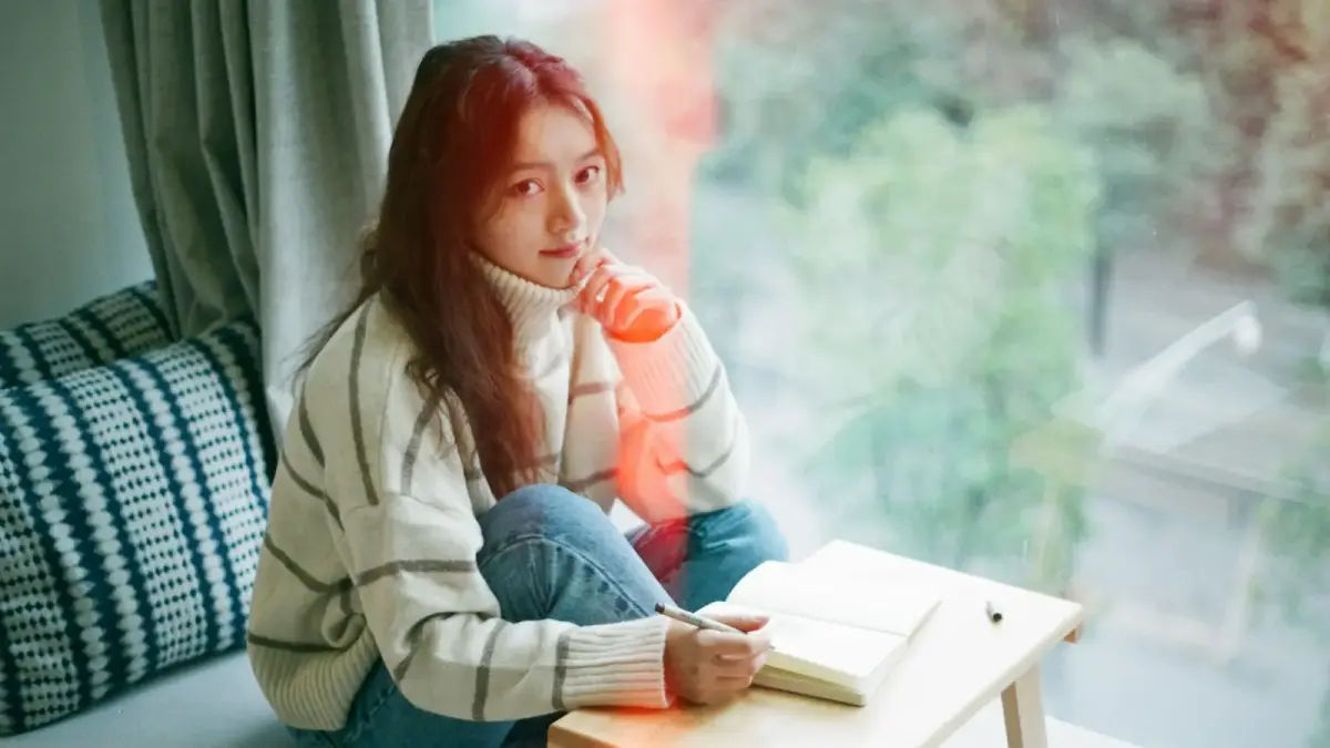 woman wearing white stripe sweater