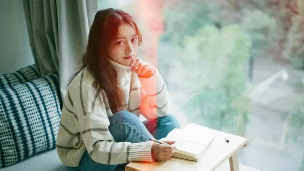 woman wearing white stripe sweater