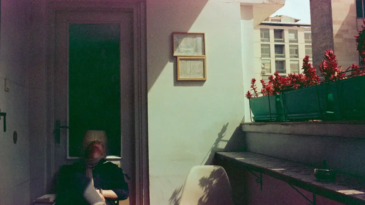 A person sitting on a chair in a room