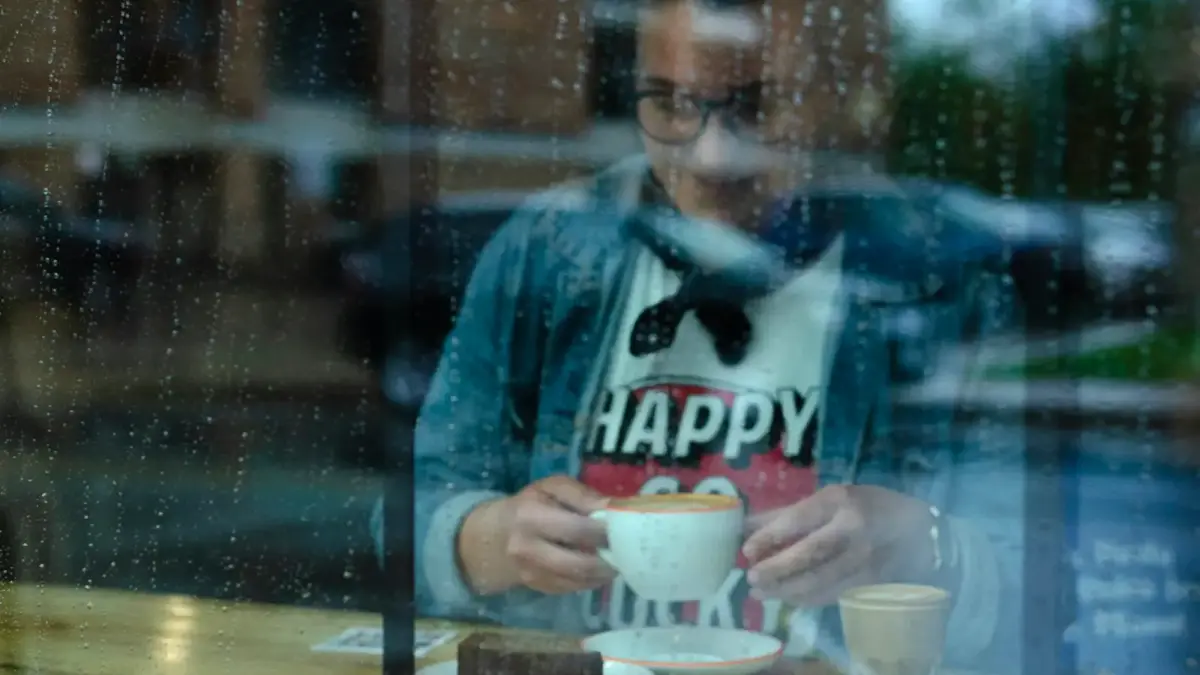 woman having coffee inside coffee shop