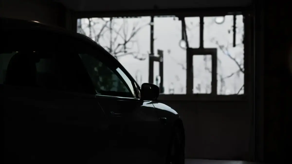 a car parked in a garage next to a window