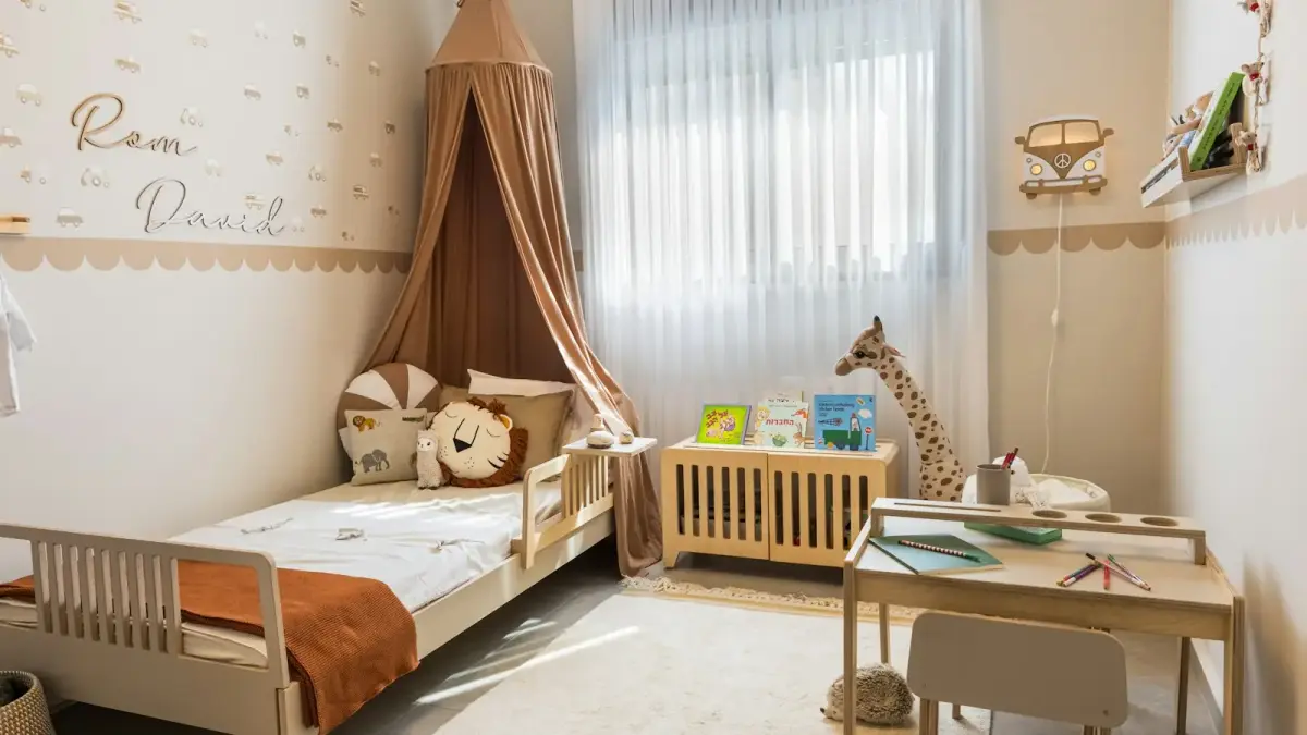 Cozy child's bedroom with bed and desk.