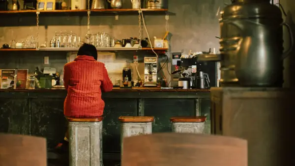 Person sits at a vintage diner counter