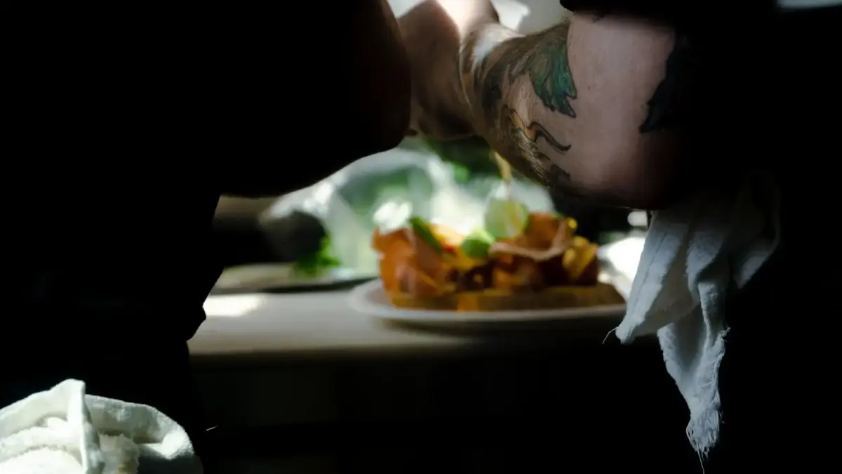 person with green and black tattoo on arm