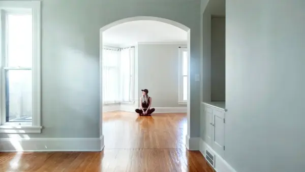 brown short coated dog on brown wooden parquet floor