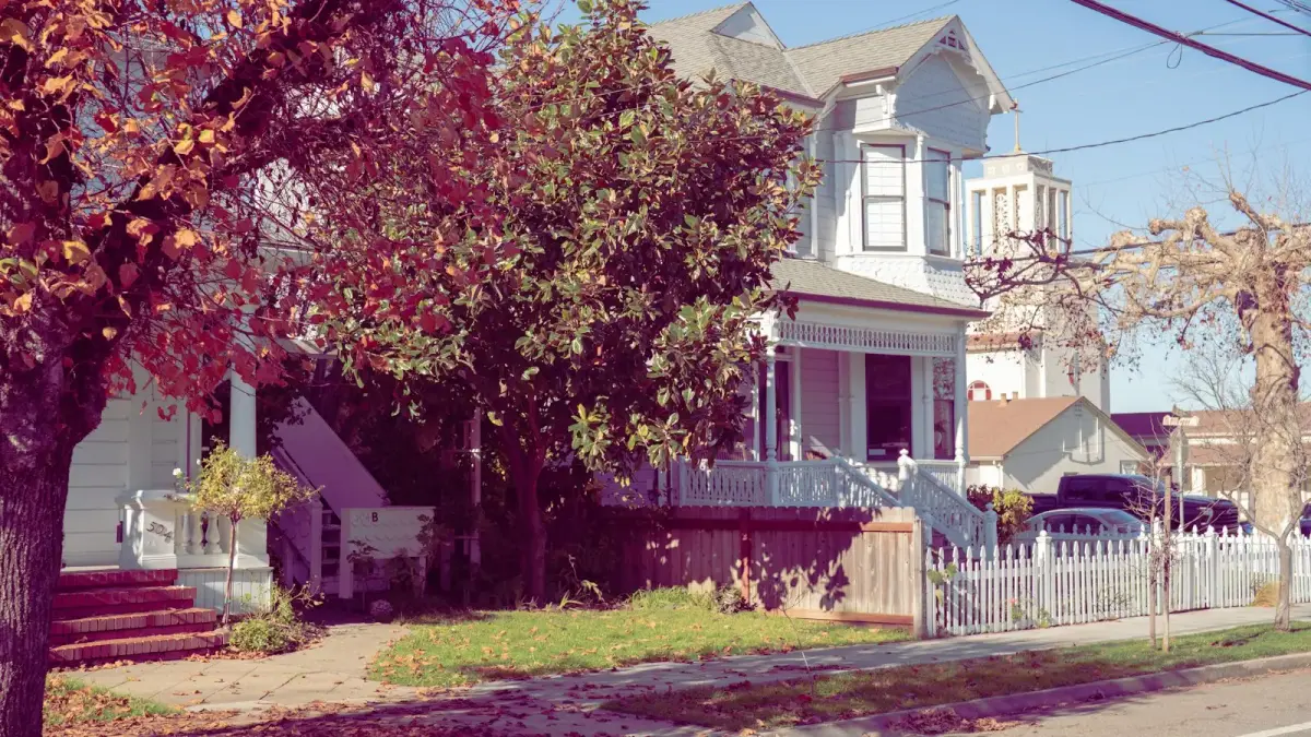 Victorian house with a white picket fence.