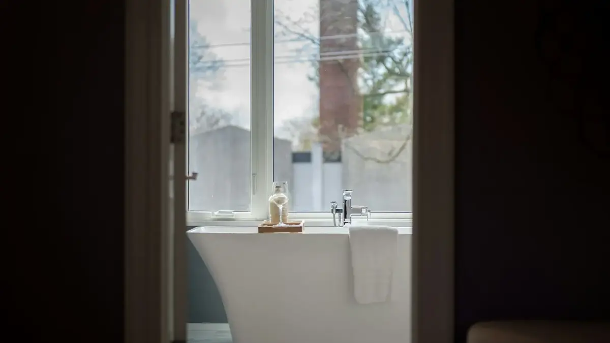 Modern freestanding bathtub with a large window view