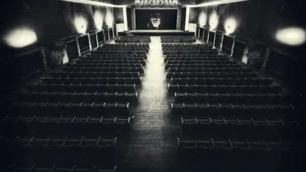 Empty vintage cinema hall with a screen