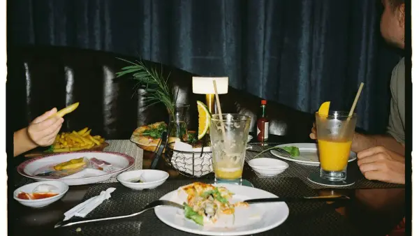 Table with leftover food and drinks after meal