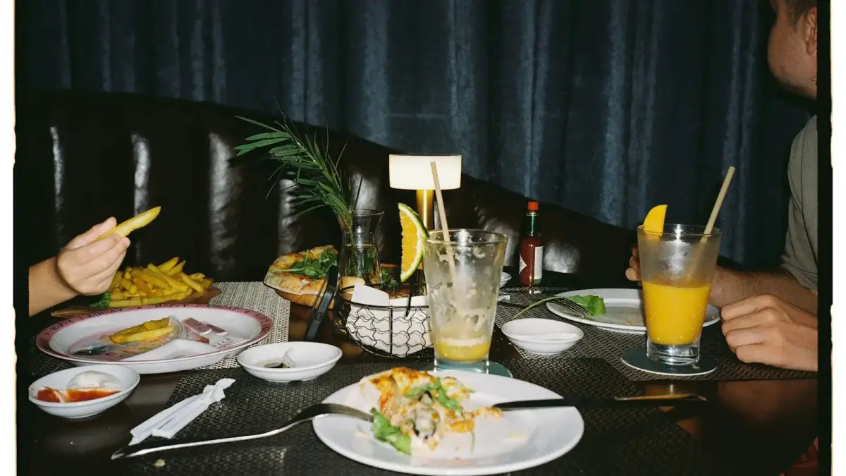Table with leftover food and drinks after meal