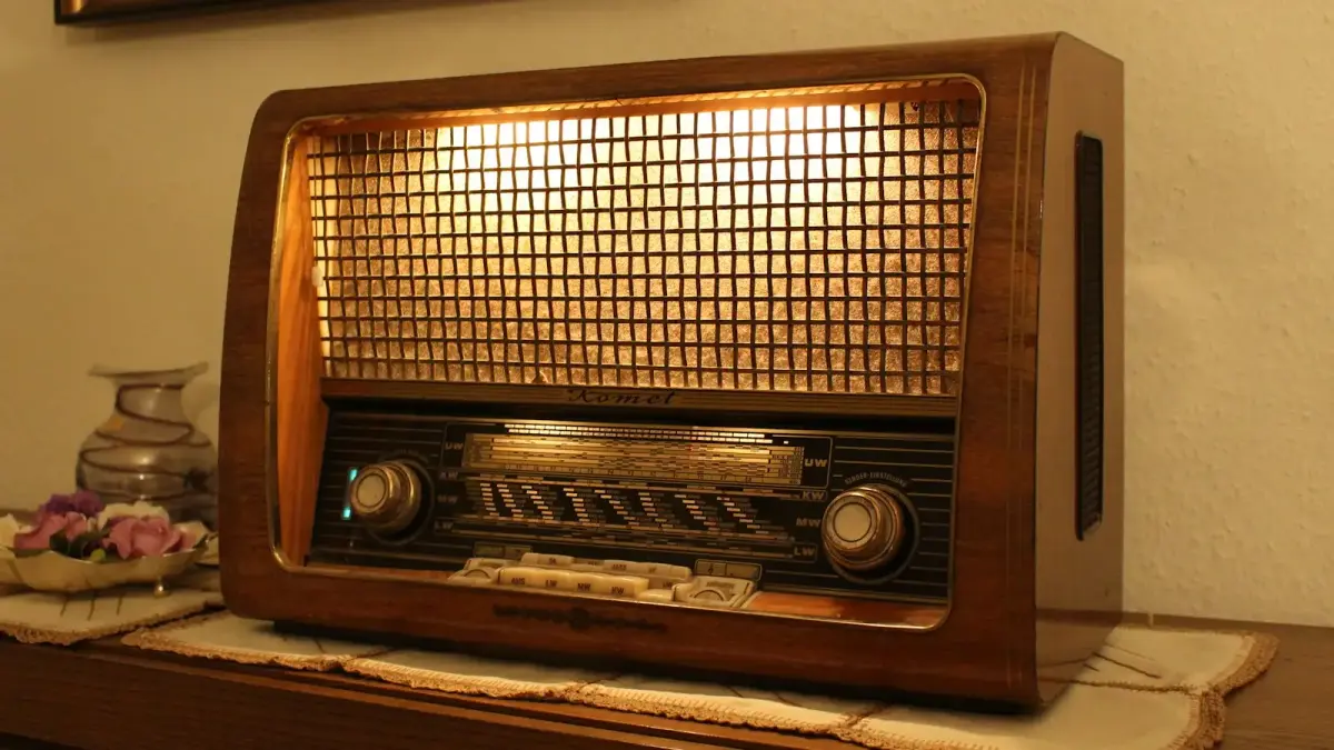 brown and black radio on brown wooden table