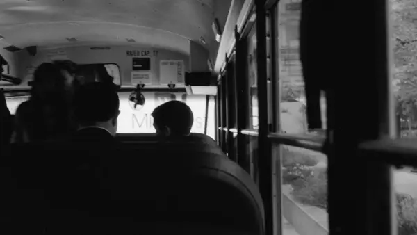 People riding on a school bus
