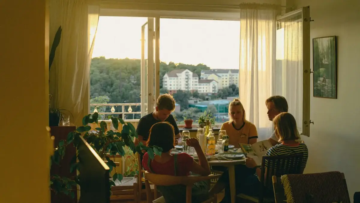 a group of people sitting around a table