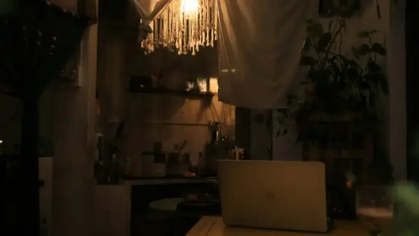 a warm family dinner table scene with golden light
