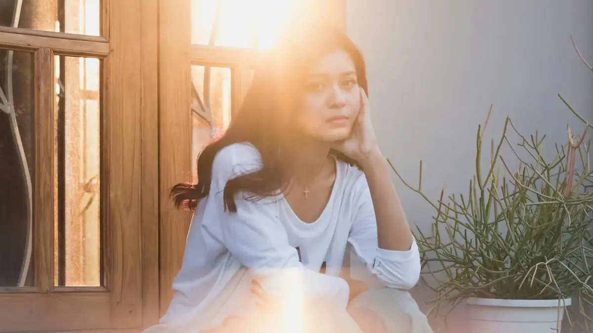 woman in white dress sitting on chair