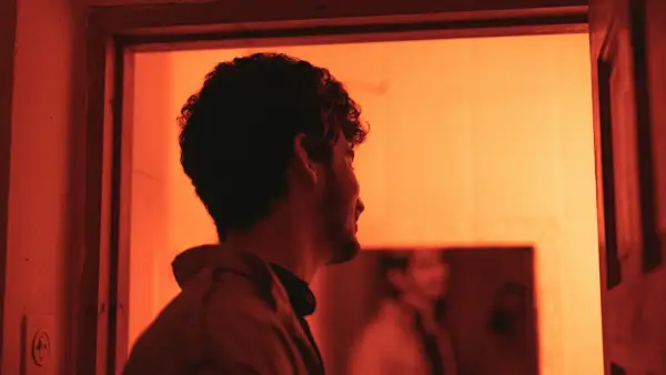 a man standing in front of a mirror in a room