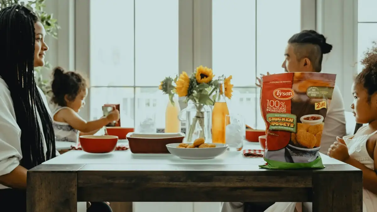woman in black tank top sitting on chair in front of table with orange ceramic bowl
