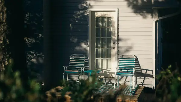 Two older friends sitting together in quiet, peaceful afternoon golden light