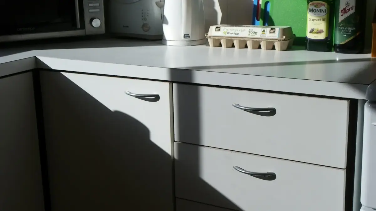 white ceramic mug on white wooden drawer
