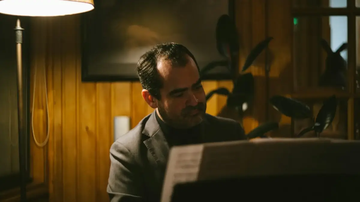 A man sitting at a computer in a room