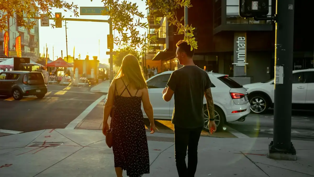 a man and a woman walking down a street