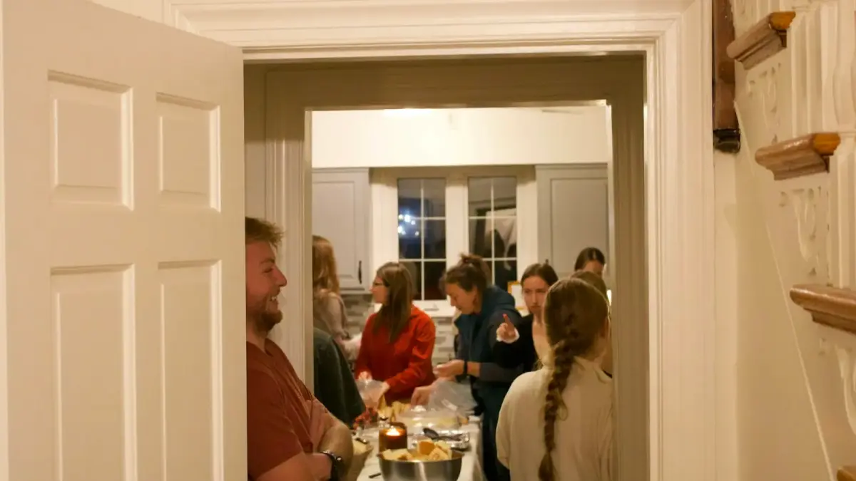 People gathered in a kitchen during a party