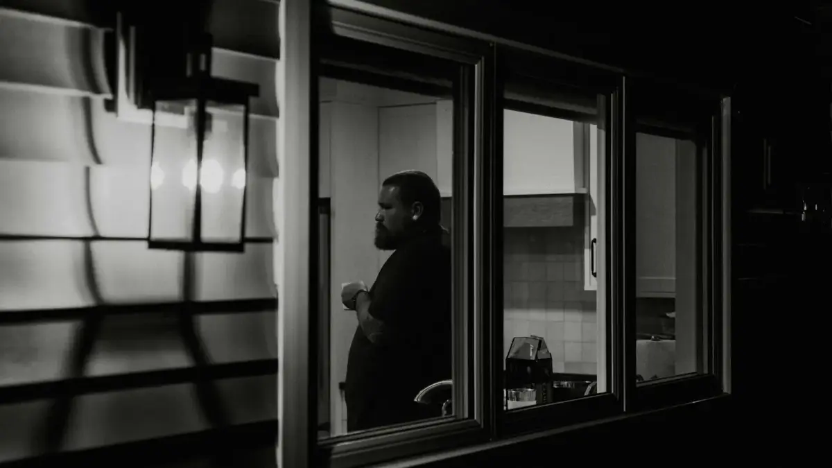 A man looking out of a train window