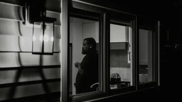 A man looking out of a train window