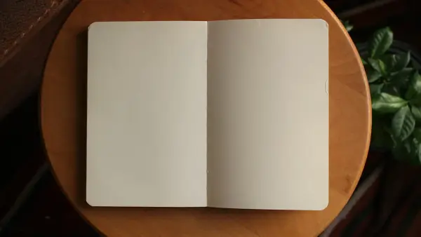white printer paper on brown wooden table