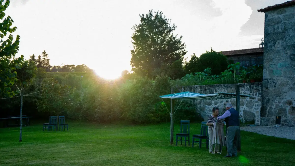 Couple embracing in a garden at sunset