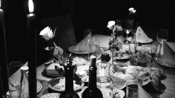 grayscale photo of cooked foods on table