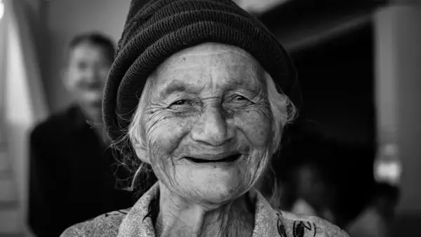 gray-scale photo of woman wearing knit cap