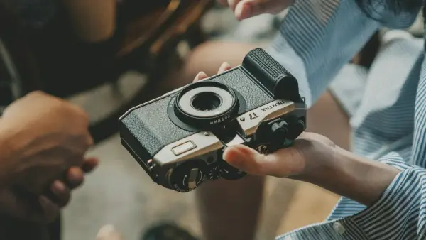 Someone is holding a camera in their hands.