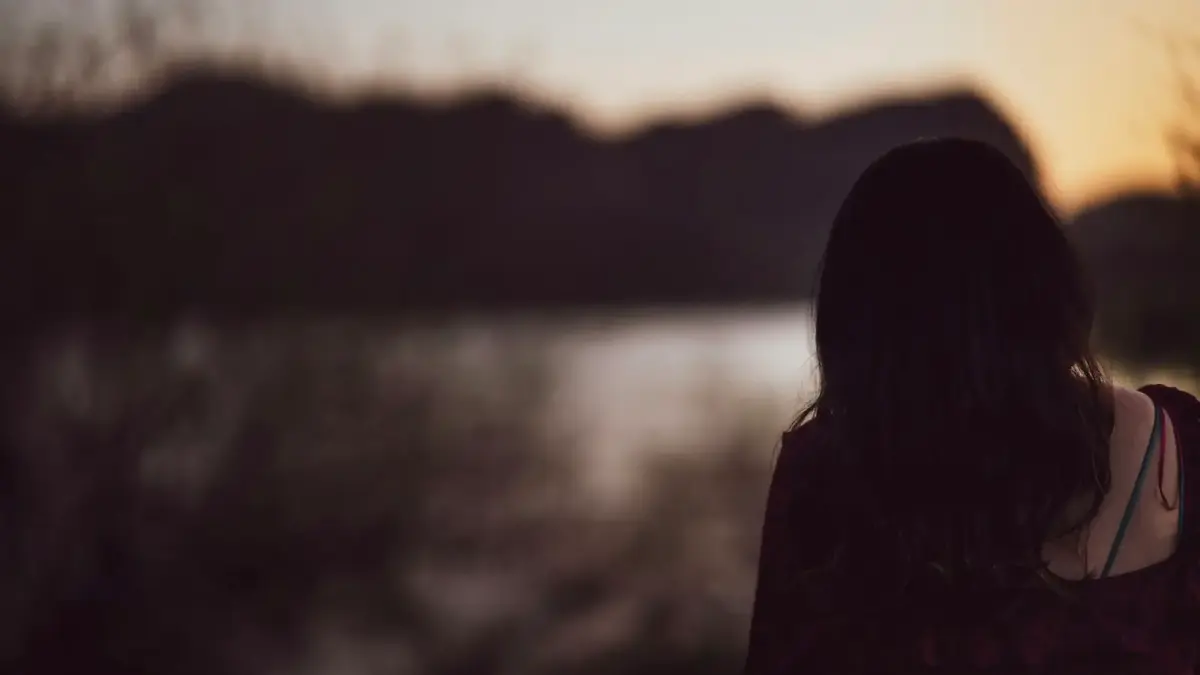 a person looking at a body of water