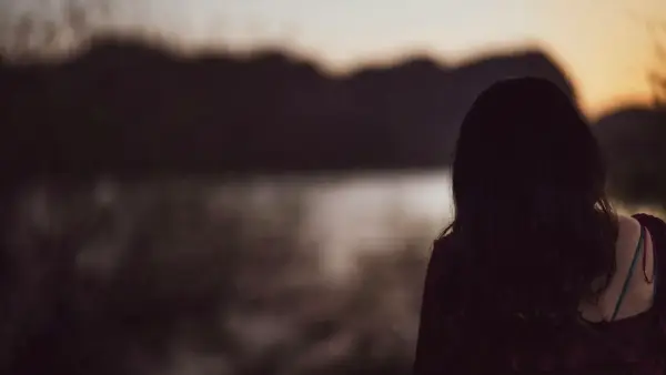 a person looking at a body of water