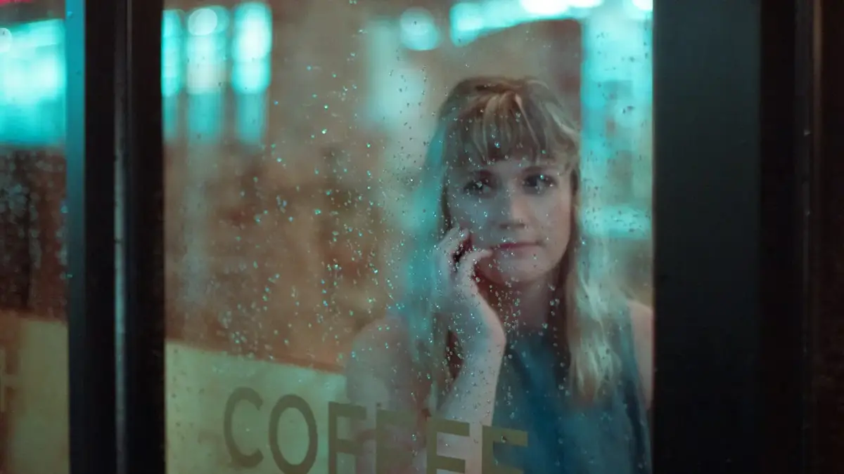 woman beside glass window