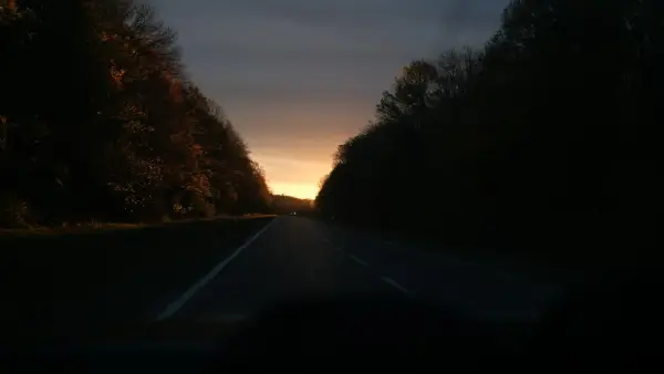 Driving on a road at sunset