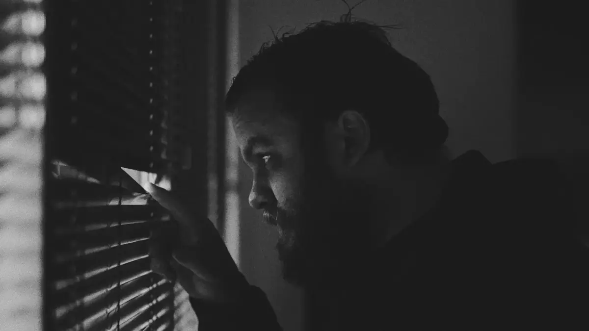 man looking in the window