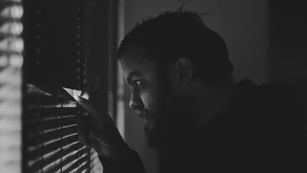 man looking in the window
