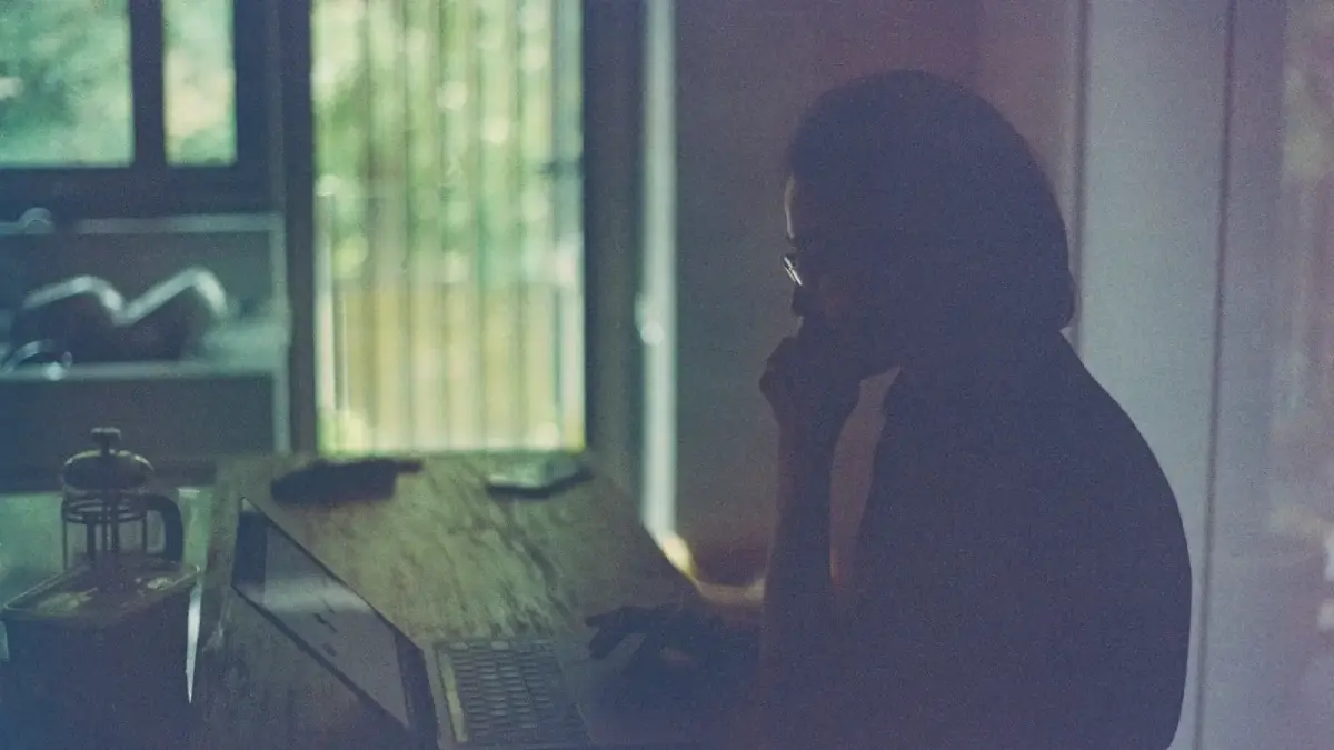 silhouette of woman sitting on chair