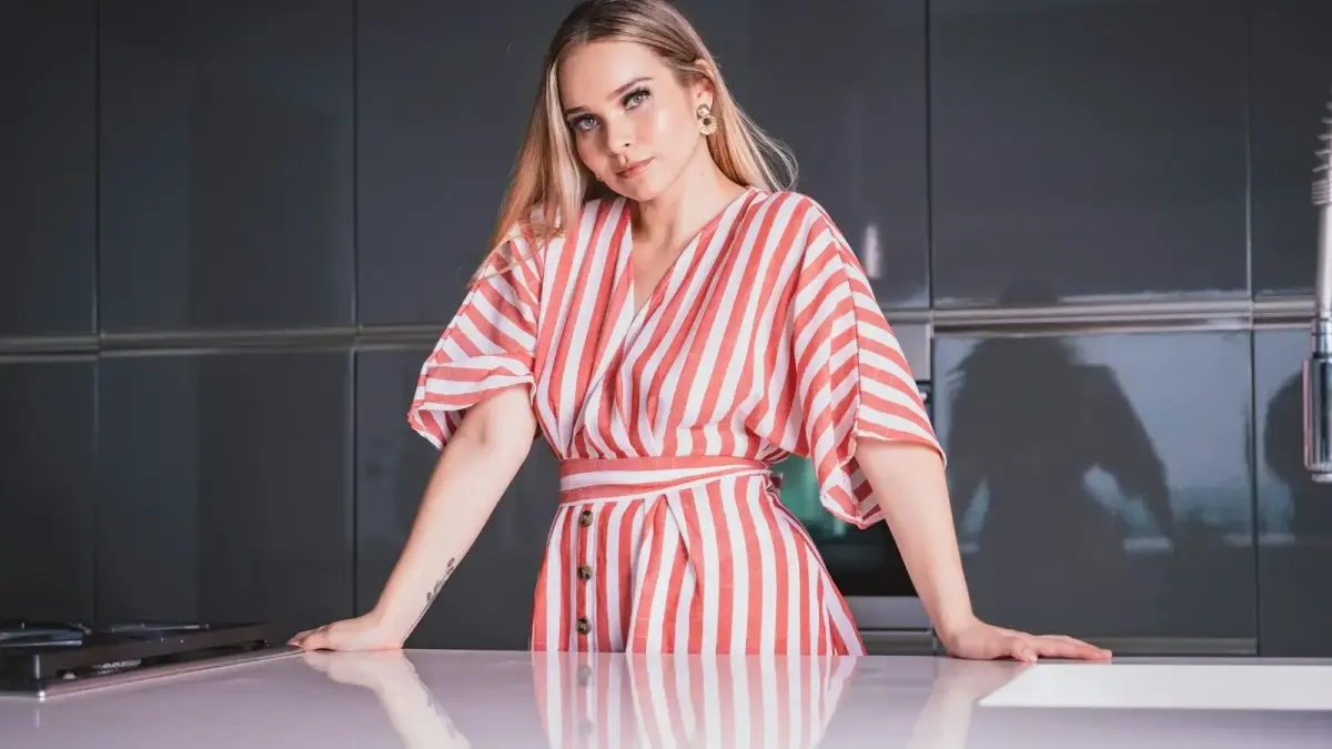 woman in red and white stripe dress