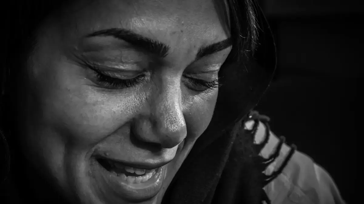 A black and white close-up of a woman's face