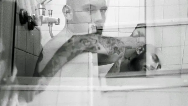 a man taking a picture of himself in a mirror
