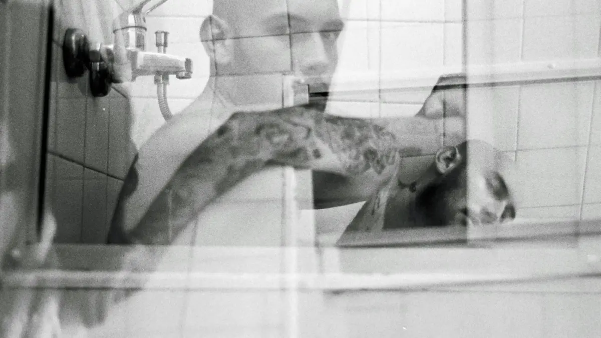 a man taking a picture of himself in a mirror