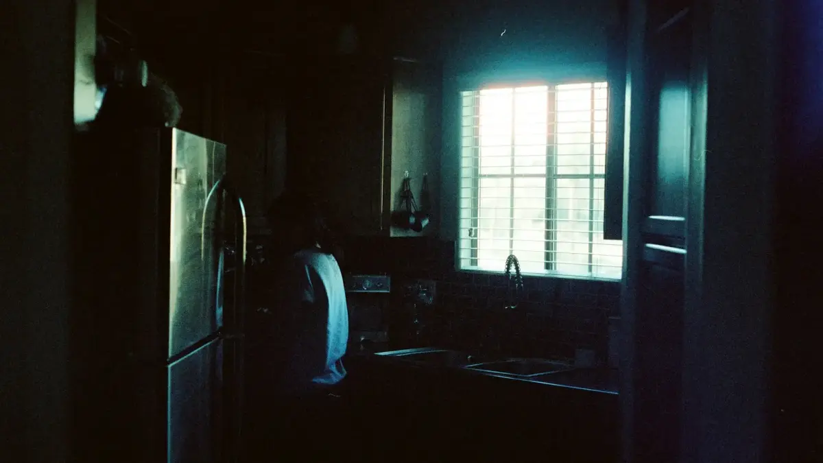 white top mount refrigerator beside white wooden door