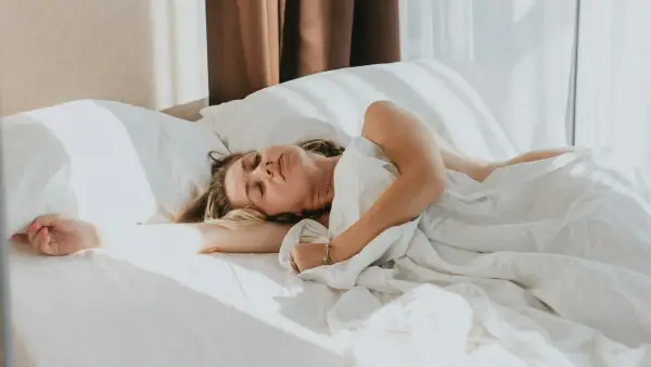 a person lying in a bed
