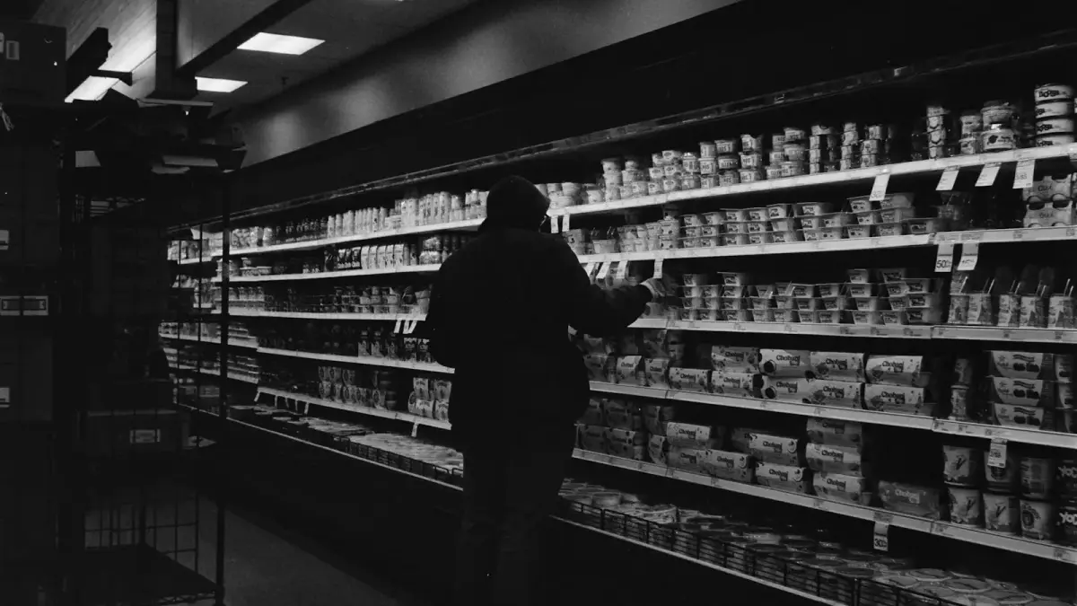 Person shopping in a grocery store aisle