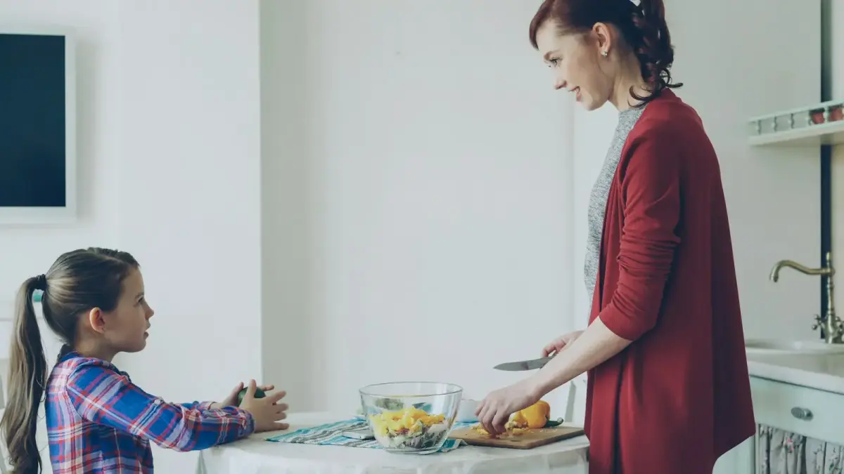 Mother and daughter cooking in the kitchen together