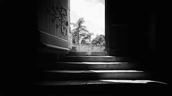 grayscale photo of concrete staircase