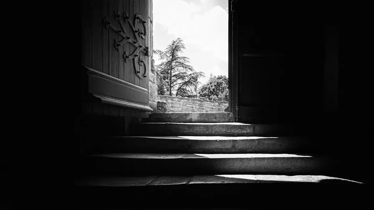 grayscale photo of concrete staircase